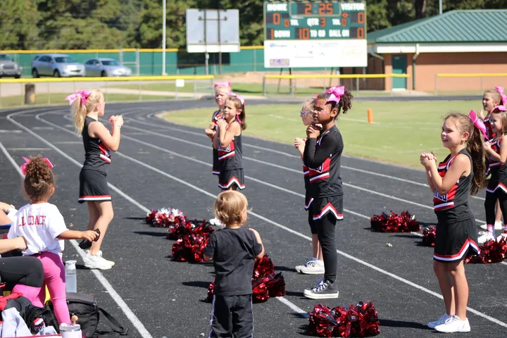 Four Oaks Cardinals cheerleaders on the sideline