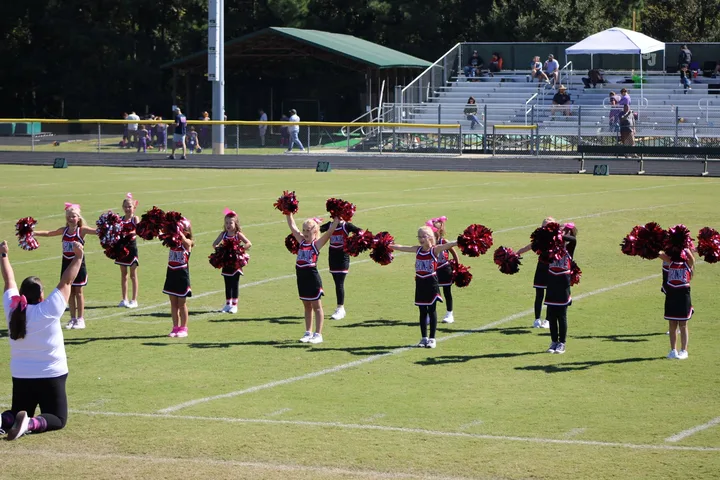 Four Oaks Cardinals cheerleaders on the sideline