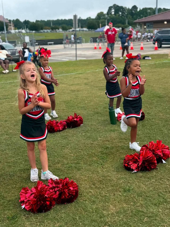 Four Oaks Cardinals cheerleaders on the sideline
