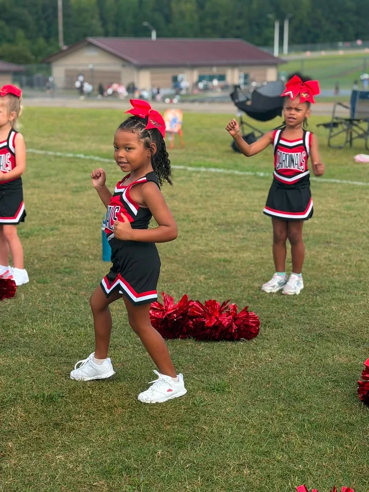 Four Oaks Cardinals cheerleaders on the sideline