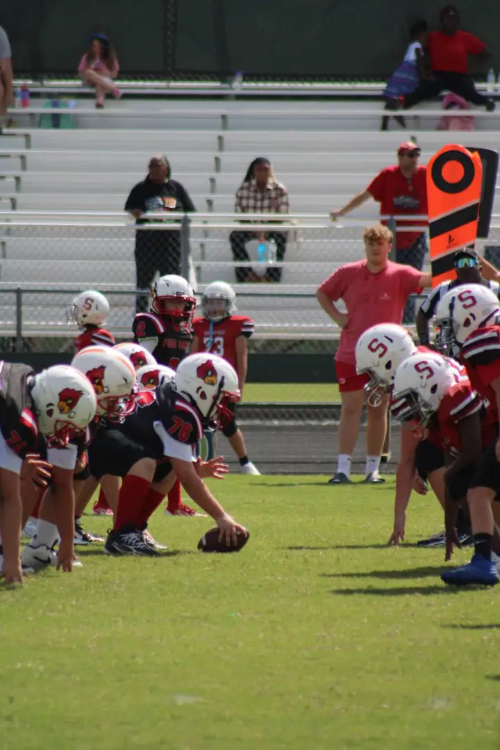 Four Oaks linemen battling at the line of scrimmage